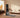 Best home gym equipment: A modern smart fitness station and mirror for workouts in a living room.