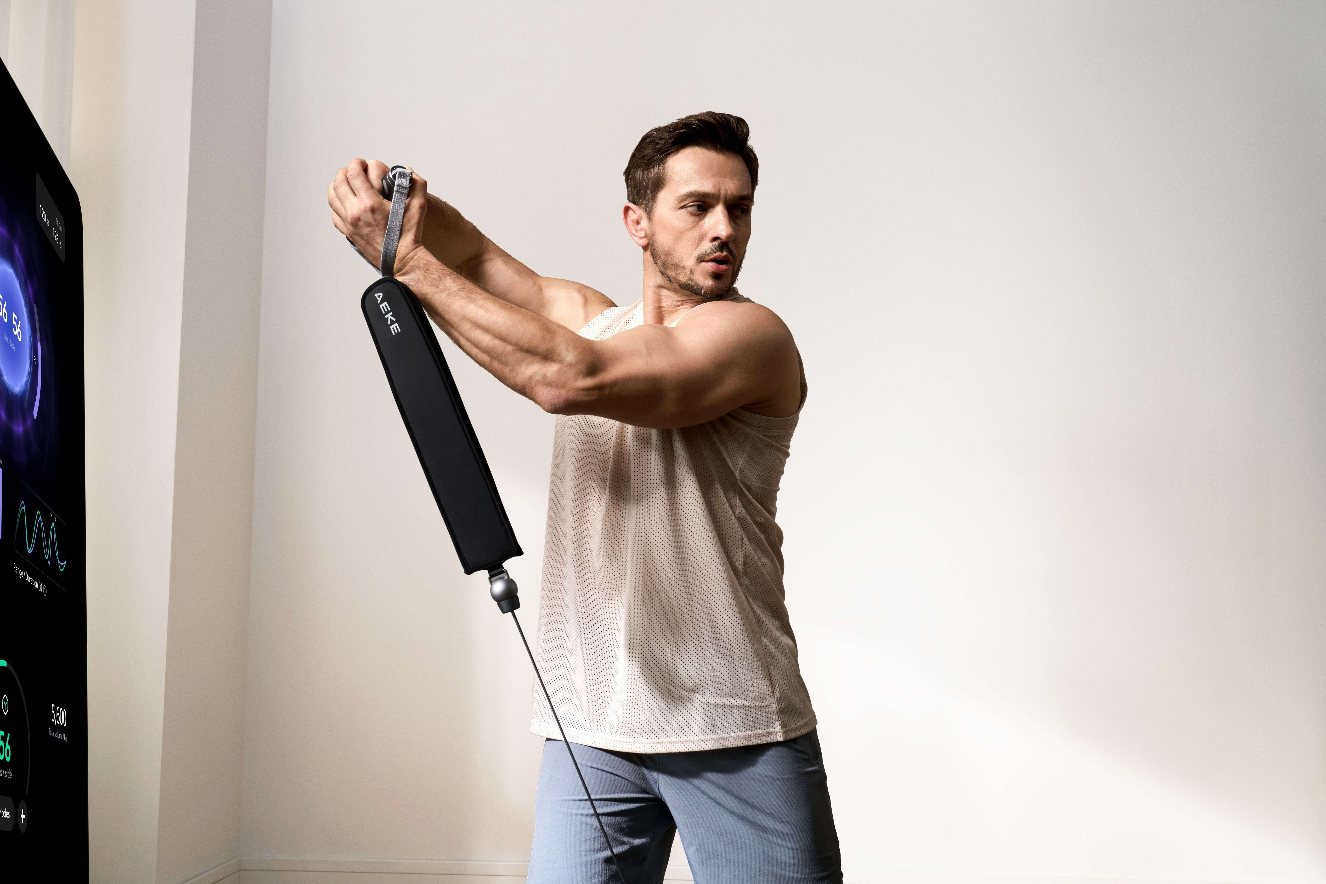 Man using AEKE strength equipment in front of home workout room mirrors, focusing on smart fitness and cable rows