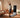 Athlete stretching in home gym, guided by smart fitness mirror screen